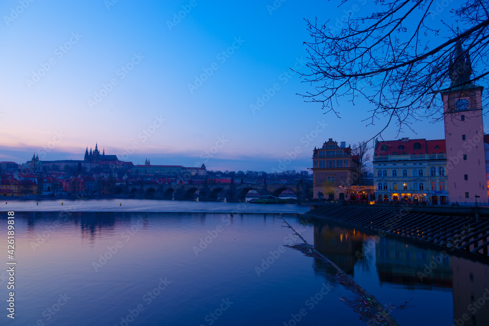 Fototapeta premium View over Vltava river or Moldau in Prague towards Prague castle and cathedral.