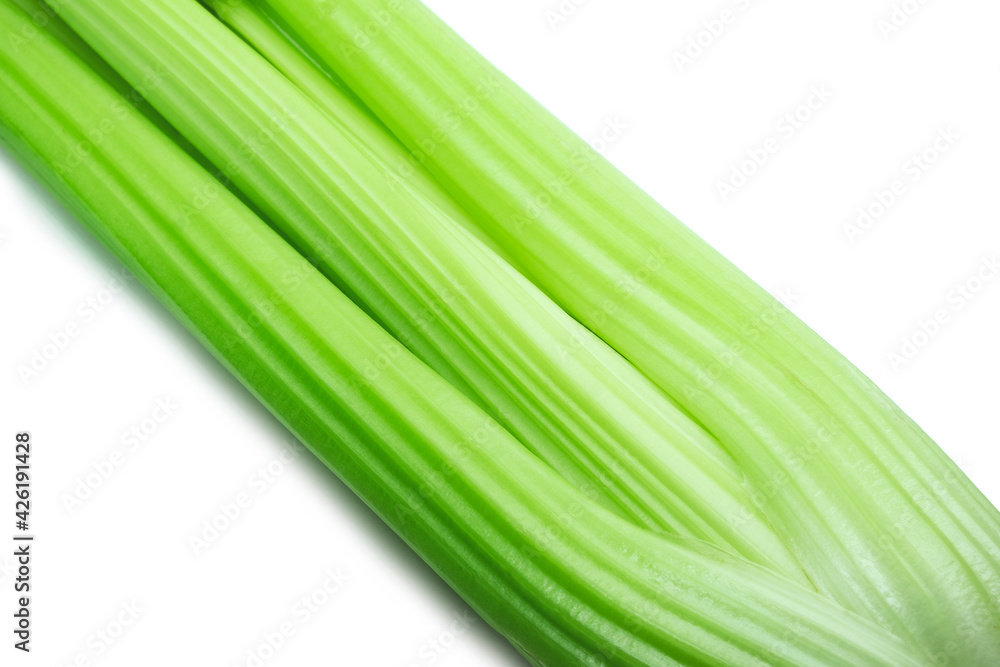 Close-up of celery stalks on white background. Fresh green vegetables. Diet concept. Close-up of celery stalks on white background. Fresh green vegetables. Diet concept.