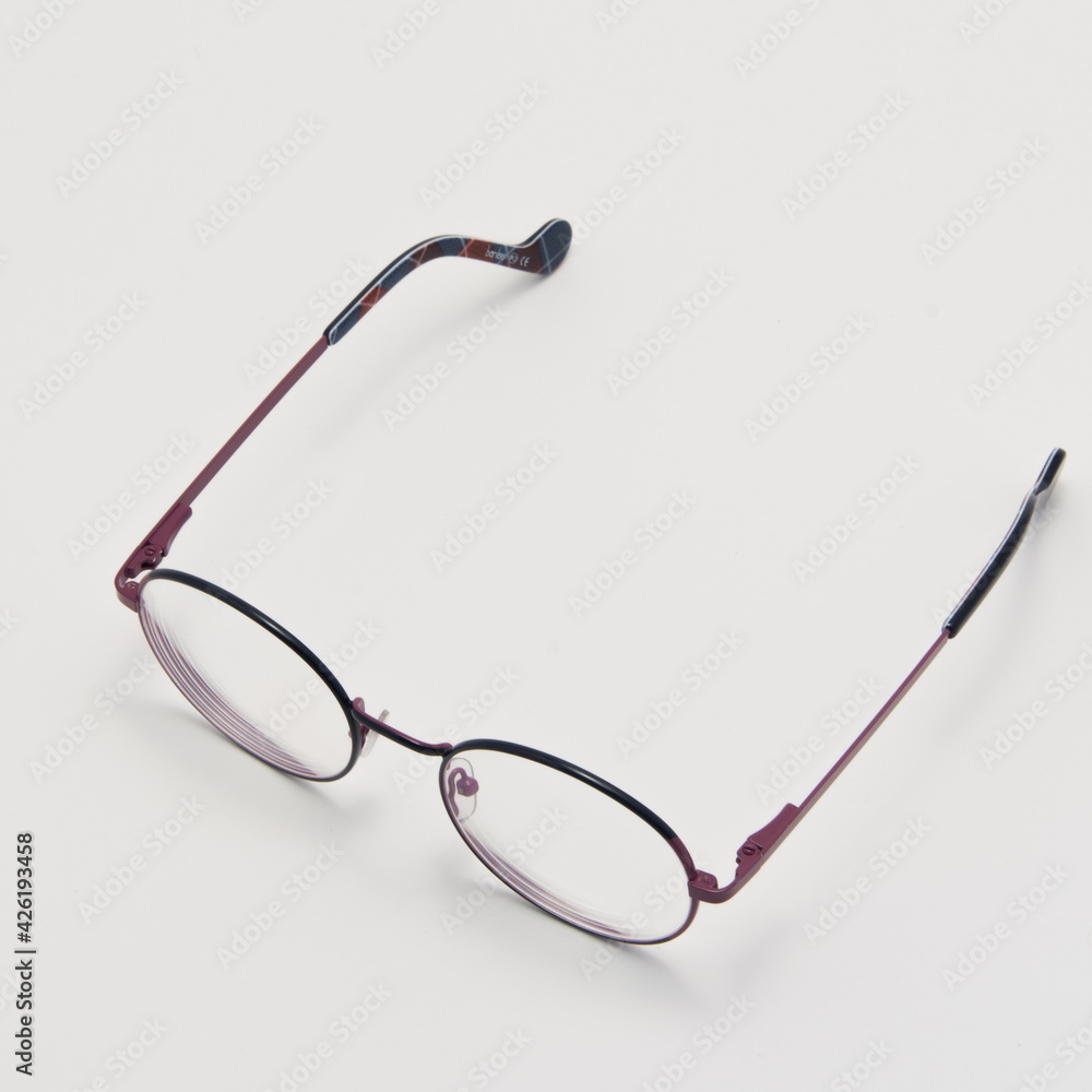 Transparent round glasses on a white background Transparent round glasses on a white background
