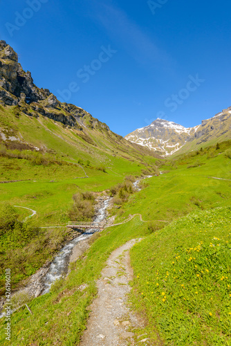 Crossing the Alps. Hiking trail in the Alps. Murren. Switzerland.