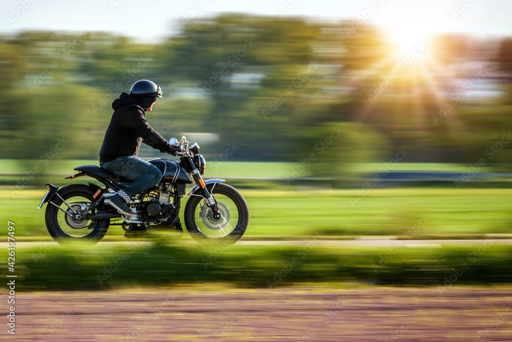 Riding motorcycle pan technic used. copyspace for your individual text. Riding motorcycle pan technic used. copyspace for your individual text.