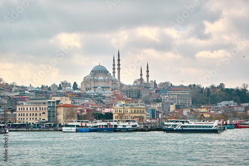 Turkey istanbul 03.03.2021. old and ancient ottoman mosques Yeni Cami mosque in istanbul turkey during morning by taken photo from istanbul bosporus. © SKahraman