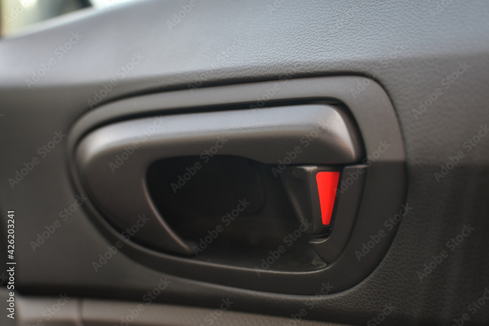 close up of a car door handle. 