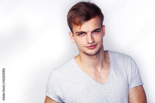 young handsome teenage hipster guy posing emotional, happy smiling against white background isolated, lifestyle people concept © iordani