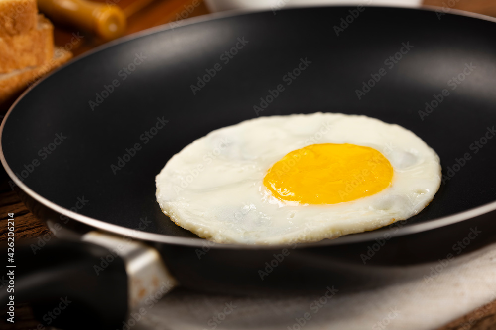 Breakfast with fried egg in the frying pan. Breakfast with fried egg in the frying pan.