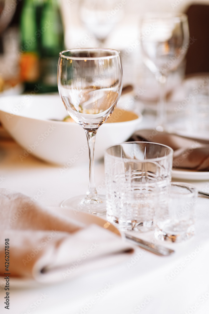 Flower table decorations for holidays and wedding dinner. Table set for holiday, event, party or wedding reception in a restaurant. Flower table decorations for holidays and wedding dinner. Table set for holiday, event, party or wedding reception in a restaurant.