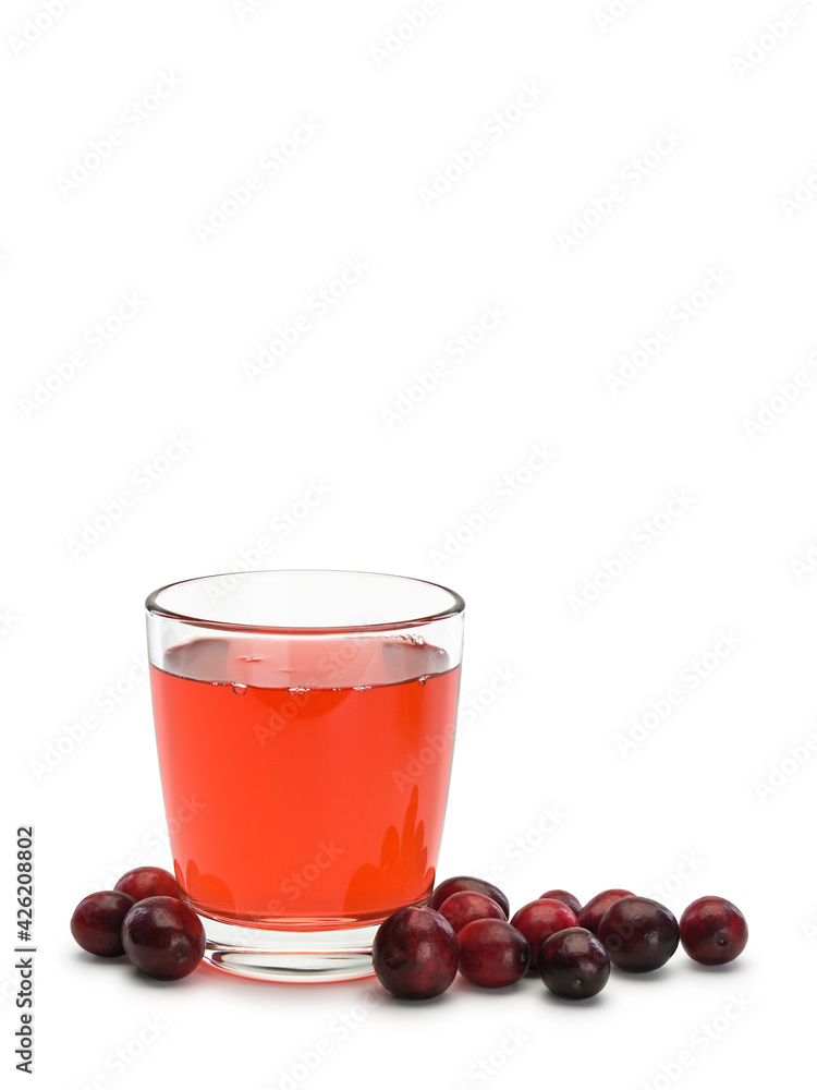 Glass filled with cranberry berry juice and scattering of berries of cranberry Glass filled with cranberry berry juice and scattering of berries of cranberry