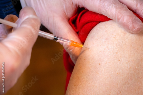 old woman injected with coronavirus vaccine