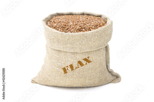 Seeds of Flax in a sack of isolated on a white background. Flax in a burlap sack. Healthy food. Flax in a jute bag. Vegan food