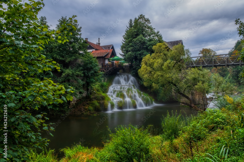 Prvi Slap - First Waterfall on Korana river canyon in village of Rastoke. Slunj in Croatia. Near Plitvice Lakes National Park. August 2020, long exposure picture.