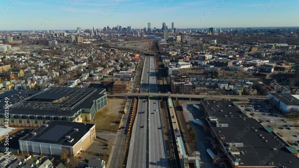 Interstate Highway 90 eastbound aerial view with Boston Back Bay at the background in Boston Landing, Massachusetts MA, USA. Interstate Highway 90 eastbound aerial view with Boston Back Bay at the background in Boston Landing, Massachusetts MA, USA.