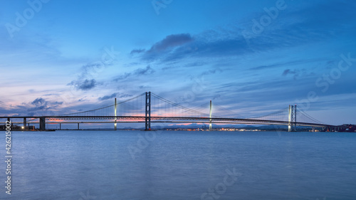 Two bridges against the sunset sky, Forth Road Bridge and Queensferry Crossing, Scotland, United Kingdom