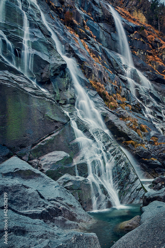 Beautiful Waterfall Vallesinella in Madonna di Campiglio in the autumn time, National Park Adamello-Brenta Italy ,Trentino Dolomite Alps photo