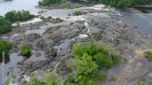 DRONE IMAGE NATURE AMAZON RIVER OIAPOQUE WATERFALLS DIVISION BETWEEN BRAZIL AND FRENCH GUIANA BOAT IN FLOREST