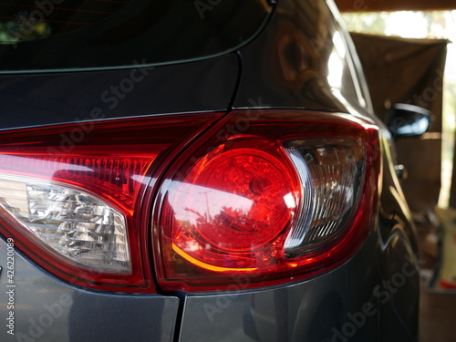 closeup of car rear tail-lamp in a modern car. © Chanonnat
