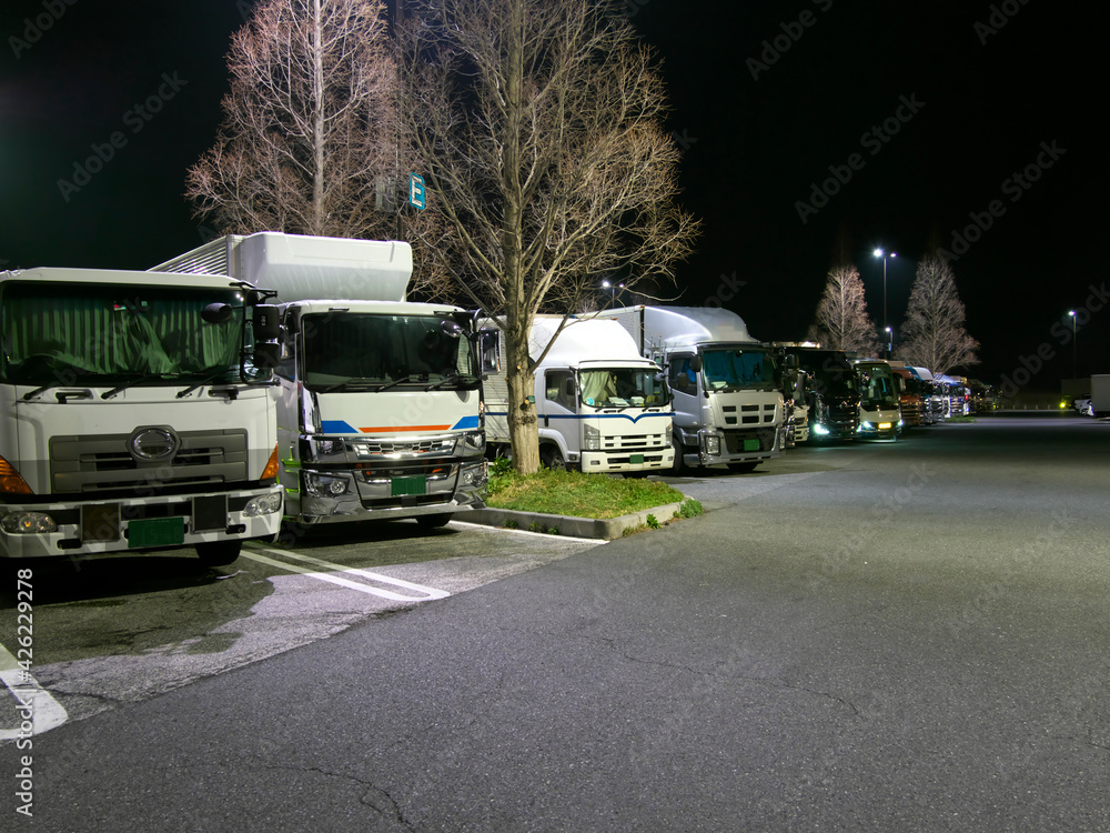 Shiga,Japan-March 27, 2021: Trucks parking at Tsuchiyama rest area on Shin-Meishin Expressway at night
