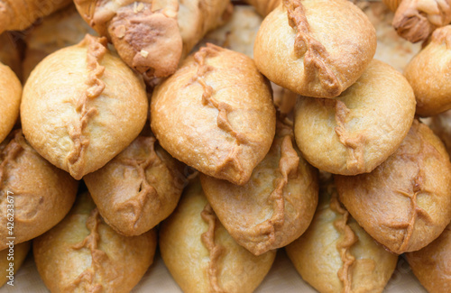 Ready-to-eat pies with filling. Traditional baking concept.