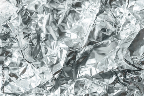 Silver crumpled foil banner background. Silver Texture, Silver Gradient background, Shiny and metal steel gradient.