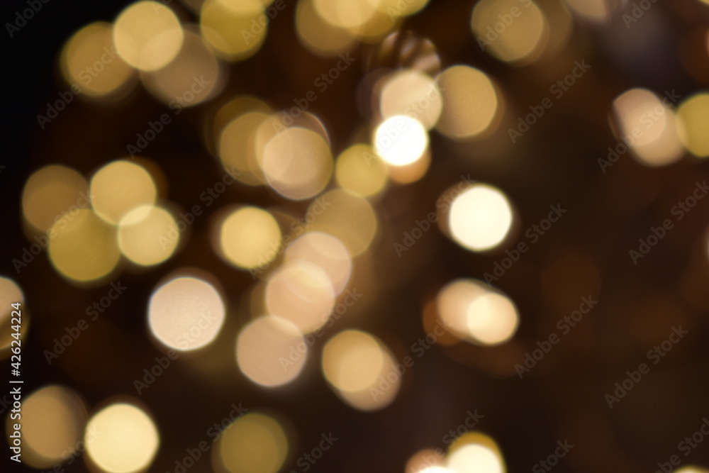 Bokeh blur of yellow fairy rice lights in dark Bokeh blur of yellow fairy rice lights in dark