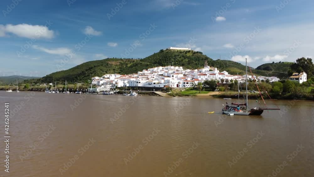 Aerial view in slow motion of Sanlúcar de Guadiana (Spain). Drone movement forward the city Aerial view in slow motion of Sanlúcar de Guadiana (Spain). Drone movement forward the city