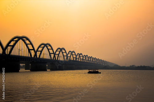 The Godavari Arch Bridge is a bowstring-girder bridge that spans the Godavari River in Rajahmundry, India. It is the latest of the three bridges that span the Godavari river at Rajahmundry.  photo
