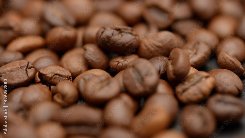Close up of seeds of coffee. Fragrant coffee beans. Top view of coffee beans. Dark Coffee Grains. Rotating and falling. Coffee beans. Close up of seeds of coffee. Beautiful seeds of coffee. Close up of seeds of coffee. Fragrant coffee beans. Top view of coffee beans. Dark Coffee Grains. Rotating and falling. Coffee beans. Close up of seeds of coffee. Beautiful seeds of coffee.