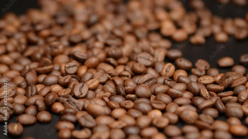 Close up of seeds of coffee. Fragrant coffee beans. Top view of coffee beans. Dark Coffee Grains. Rotating and falling. Coffee beans. Close up of seeds of coffee. Beautiful seeds of coffee. Close up of seeds of coffee. Fragrant coffee beans. Top view of coffee beans. Dark Coffee Grains. Rotating and falling. Coffee beans. Close up of seeds of coffee. Beautiful seeds of coffee.