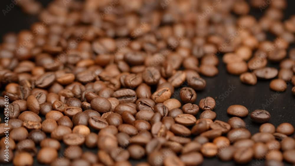 Close up of seeds of coffee. Fragrant coffee beans. Top view of coffee beans. Dark Coffee Grains. Rotating and falling. Coffee beans. Close up of seeds of coffee. Beautiful seeds of coffee. Close up of seeds of coffee. Fragrant coffee beans. Top view of coffee beans. Dark Coffee Grains. Rotating and falling. Coffee beans. Close up of seeds of coffee. Beautiful seeds of coffee.