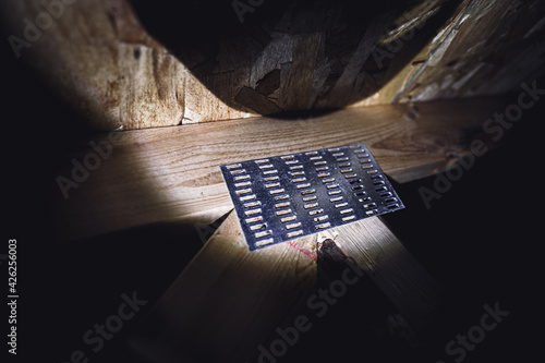 Картината върху платно Rafter galvanized mending nail plate in an attic connecting a joint