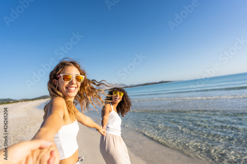 Принти на полотні Two young beautiful girls with colorful sunglasses dress boho in summer looking