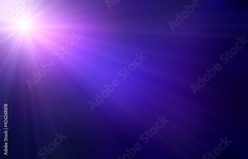 Single star glare in dark purple night sky abstract blur pattern. Empty background.