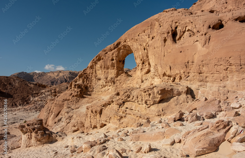 The Great Arch in Timna national park, southern Israel. Famous tourist attraction in the national park. Mountain wall. 