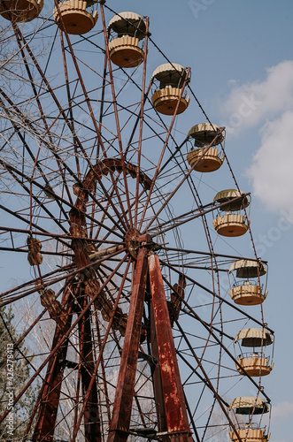 Fototapeta Naklejka Na Ścianę i Meble -  Old ferris wheel in the ghost town of Pripyat. Consequences of the accident at the Chernobil nuclear power plant