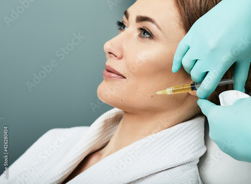 Plasmolifting injection, plasma therapy. Cosmetology procedure for woman's face skin using blood plasma