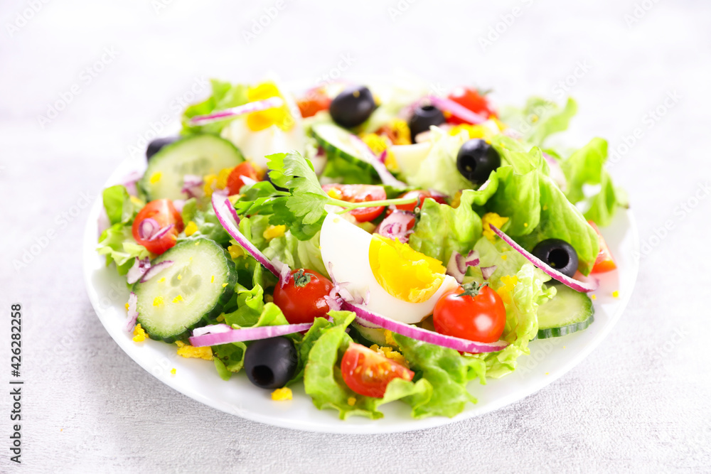 vegetable salad with egg, cucumber and tomato