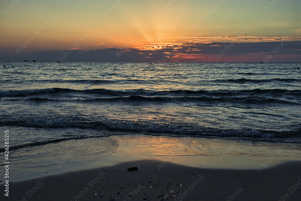 Sun setting over the ocean at Golden Bay, Malta.