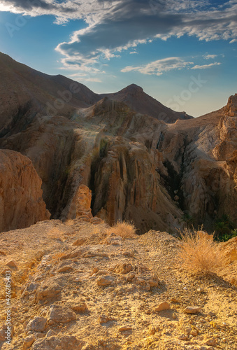 morning in the desert Atlas Mountains, mountains against the background of blue sky and clouds,