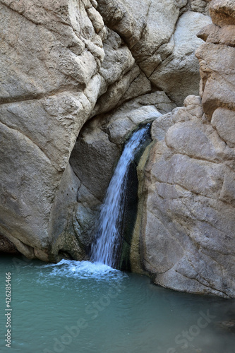 waterfall in the mountain gorge of the desert Atlas Mountains