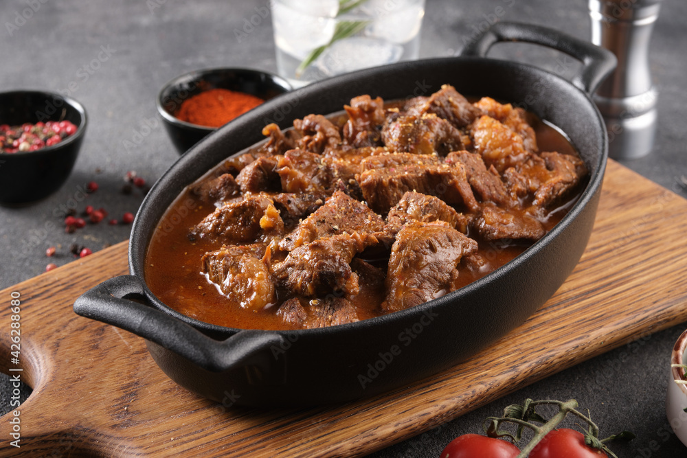 Goulash traditional Hungarian Beef Meat Stew or Soup with vegetables and tomato and paprika sauce.
