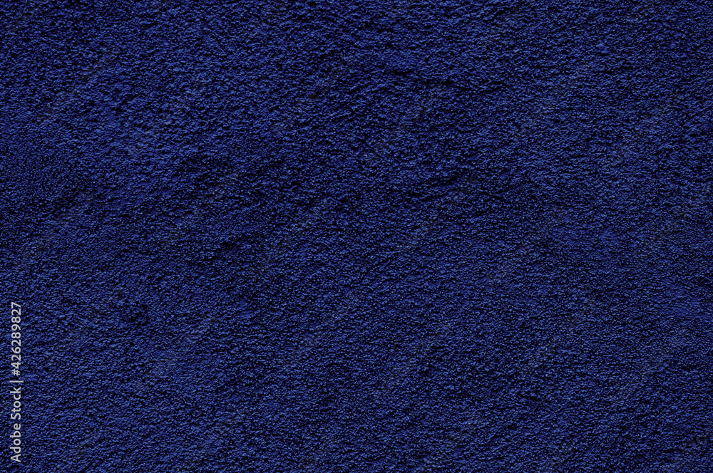 Dark blue rough texture with small specks Dark blue rough texture with small specks