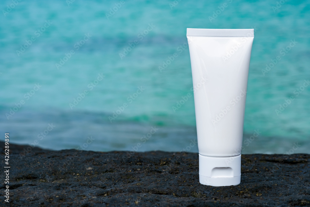 empty cosmetic skin care cream or sun block with sea beach background travel vacation accessory empty cosmetic skin care cream or sun block with sea beach background travel vacation accessory