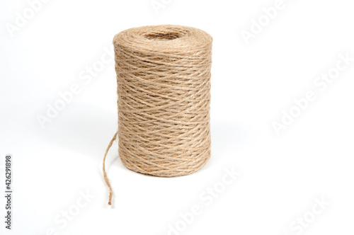 a skein of jute rope on a white background with a large plan
