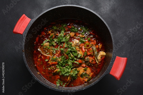 Moroccan fish  with chermoula, red peppers and preserved lemon. Spicy traditional  Moroccan food