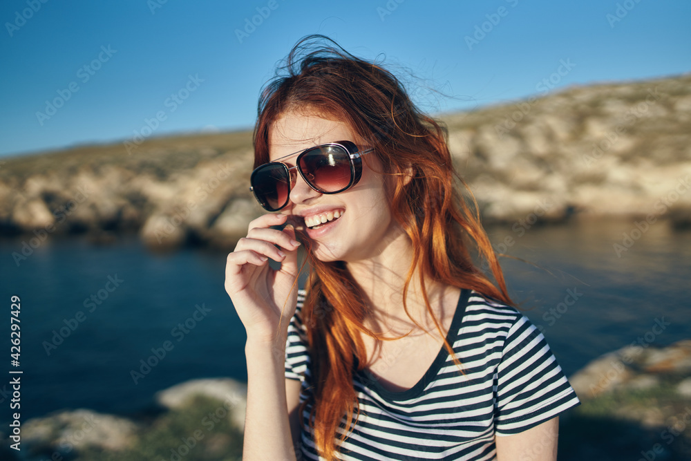 young traveler in t-shirt walking on the beach near the lake summer vacation high mountains young traveler in t-shirt walking on the beach near the lake summer vacation high mountains