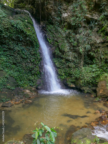 Fototapeta Naklejka Na Ścianę i Meble -  View of Kandela waterfall near Tindoli village on the banks of lake Poso, Central Sulawesi, Indonesia