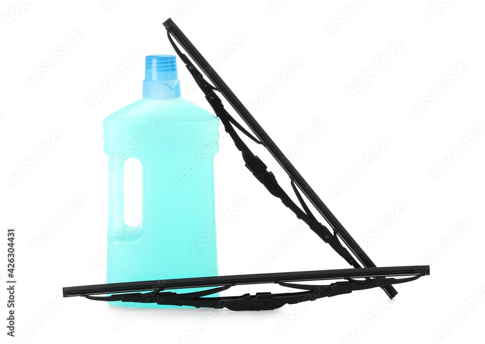 Fototapeta premium Bottle of windshield washer fluid and wipers on white background