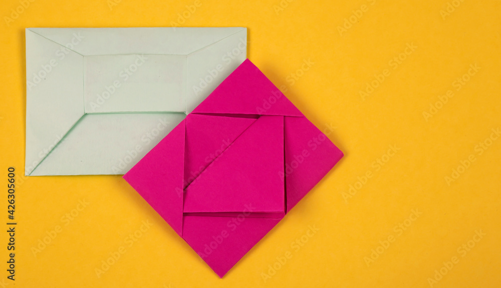 Several colorful envelopes on a yellow background. Several colorful envelopes on a yellow background.