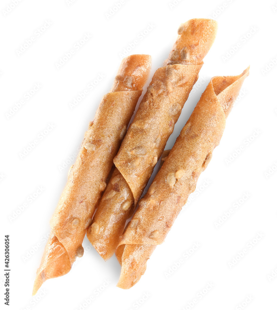 Delicious fruit leather rolls on white background, top view Delicious fruit leather rolls on white background, top view