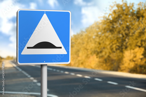 Sign Speed Bump near asphalt road outdoors