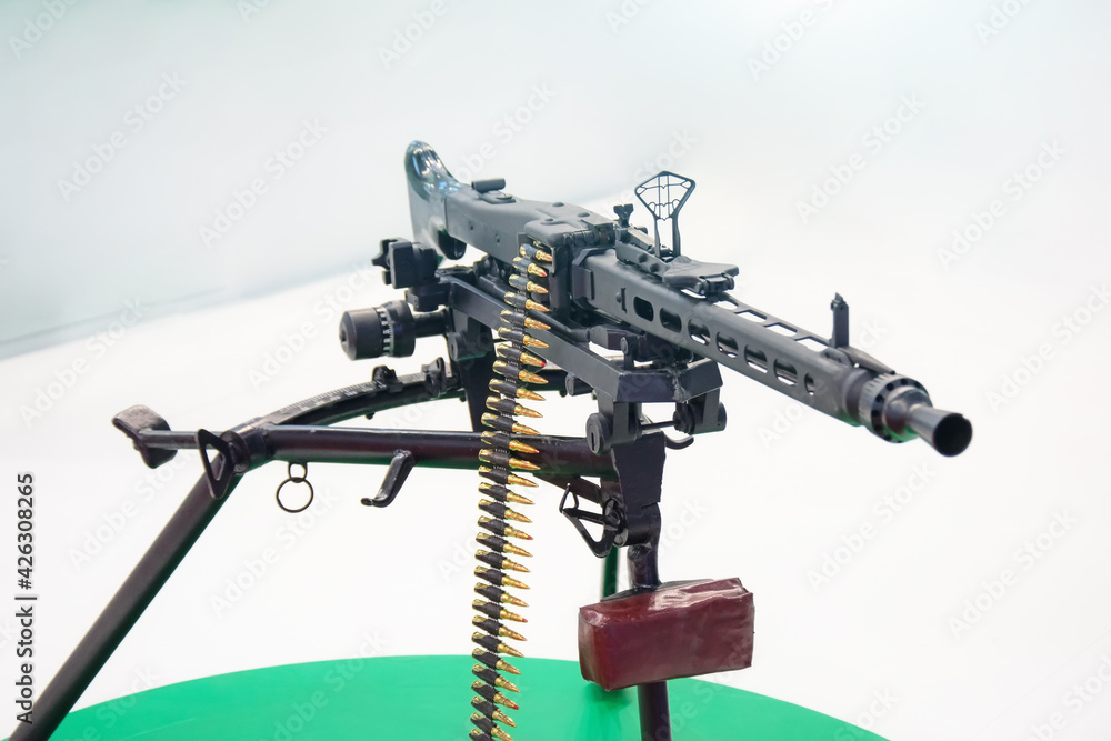 Black machine gun with chain of cartridges. Black machine gun with chain of cartridges.